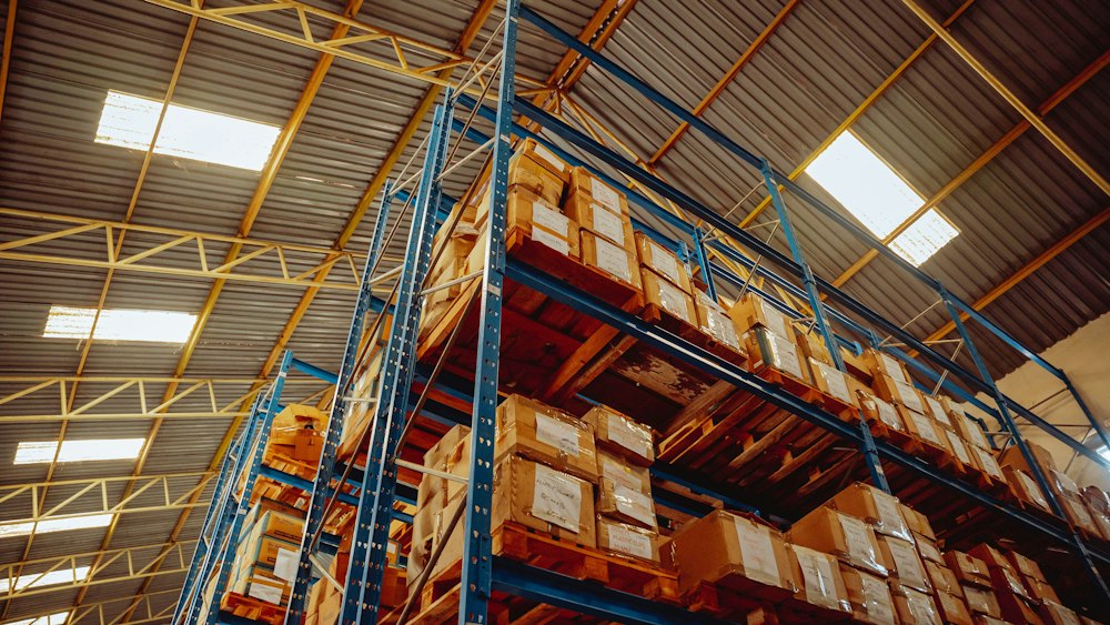 Tall warehouse shelving stacked with boxed stock