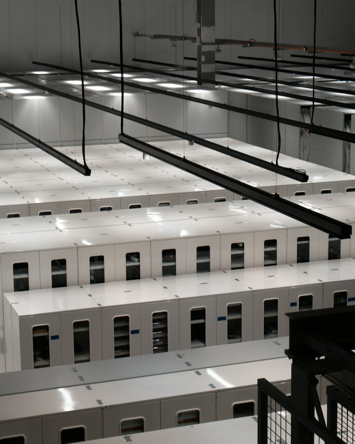 Rows of server cabinets in a modern data centre